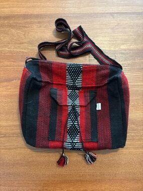 Handwoven Red and Black Striped Crossbody Bag with Tassel Detail